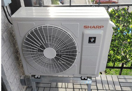 SHARP outdoor unit installed on a stand by AirGreen