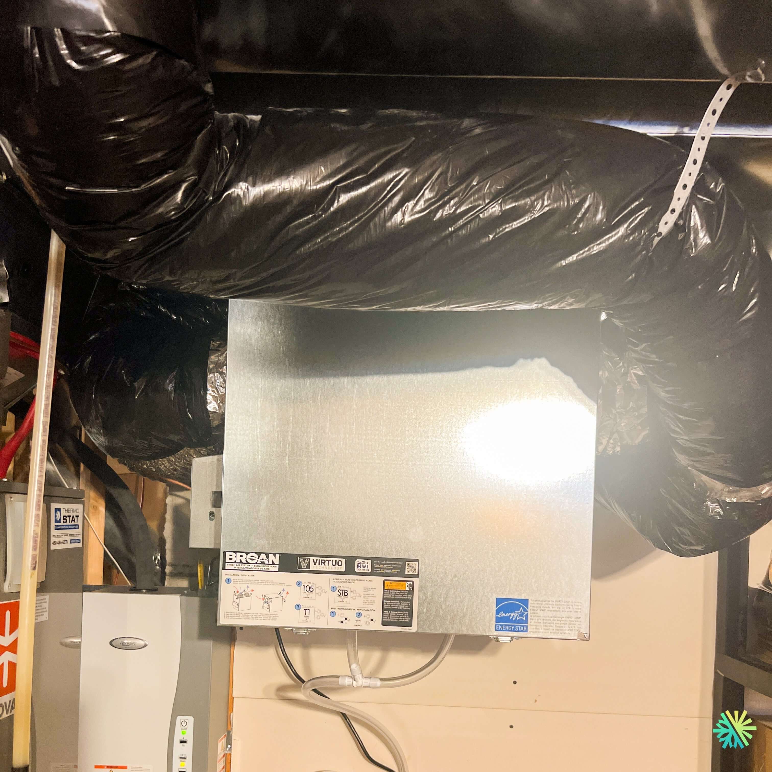 Installation of a Broan-NuTone AI Series V130H65RT air exchanger in Co ...