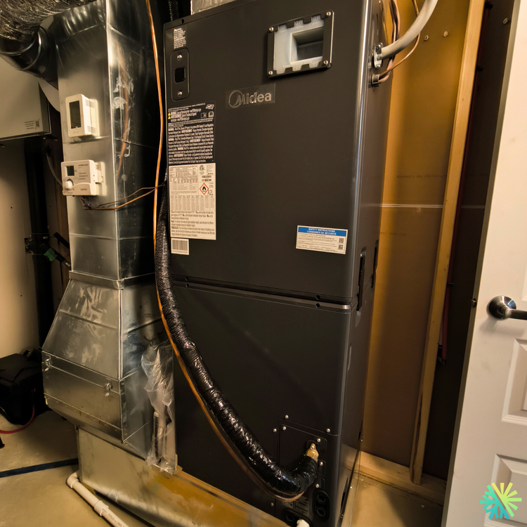 Installation d’une thermopompe centrale Midea à Sainte-Dorothée (Laval) : confort quatre saisons et intégration propre au réseau de conduits