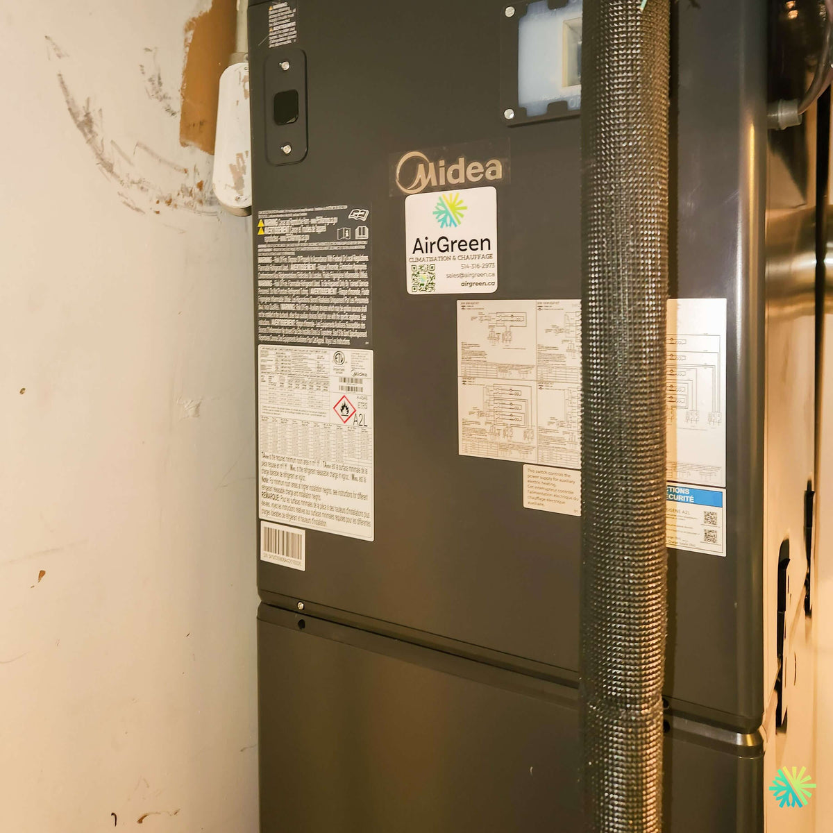 Installation d’une fournaise électrique MIDEA EVOX G3 à Henryville, en Montérégie : remplacement central dans un espace mécanique étroit