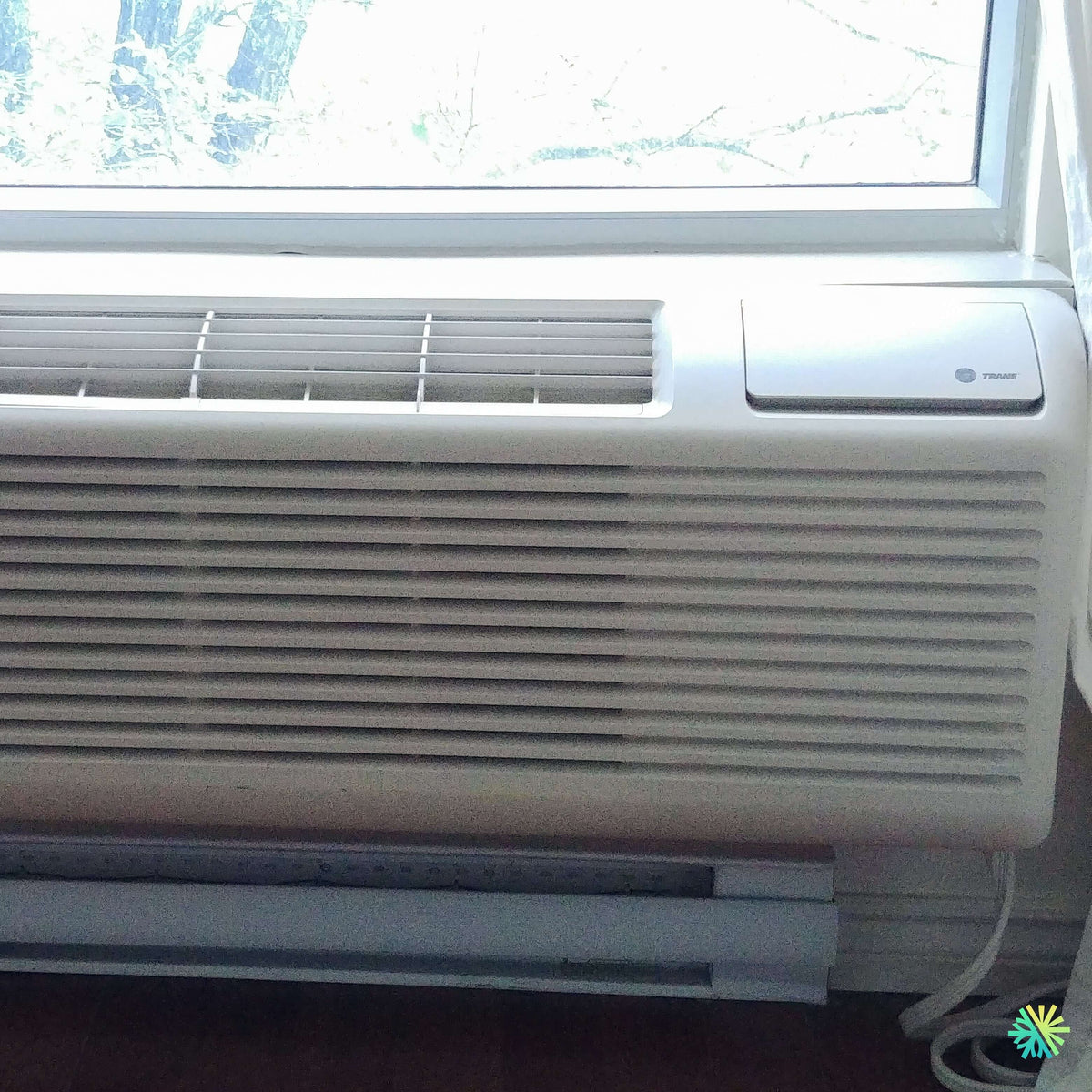 Installation of a TRANE ProSpace PTAC unit in Saint-Pie beneath a wind ...