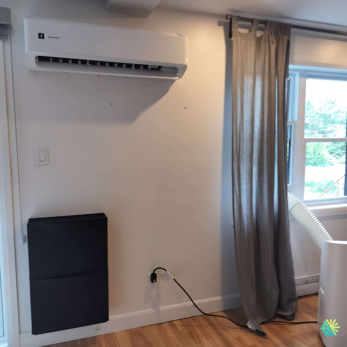 Installation of a Sharp ZU1 wall-mounted heat pump in Chomedey, Laval