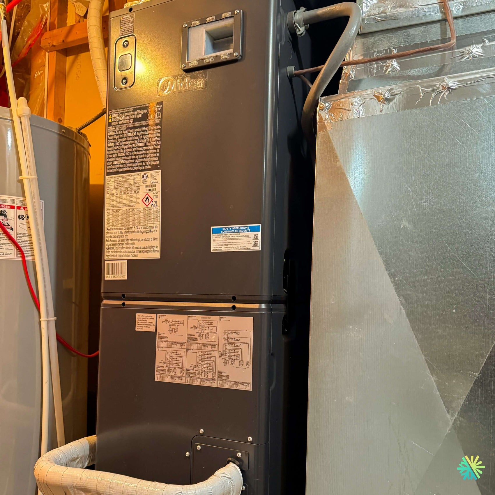 Installation d’une fournaise électrique MIDEA EVOX G3 4 tonnes avec système central et air handler à La Prairie