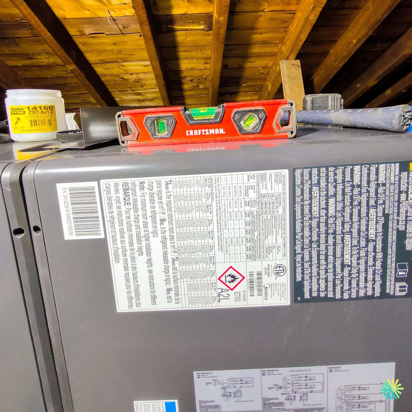 Installation d’une fournaise électrique MIDEA EVOX G3 2 tonnes à Saint-Bruno — système central avec air handler pour confort quatre saisons
