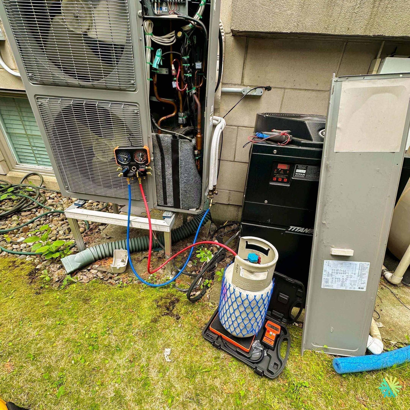 HVAC system repair with tools and refrigerant, showcasing maintenance of heating and cooling unit outdoors.