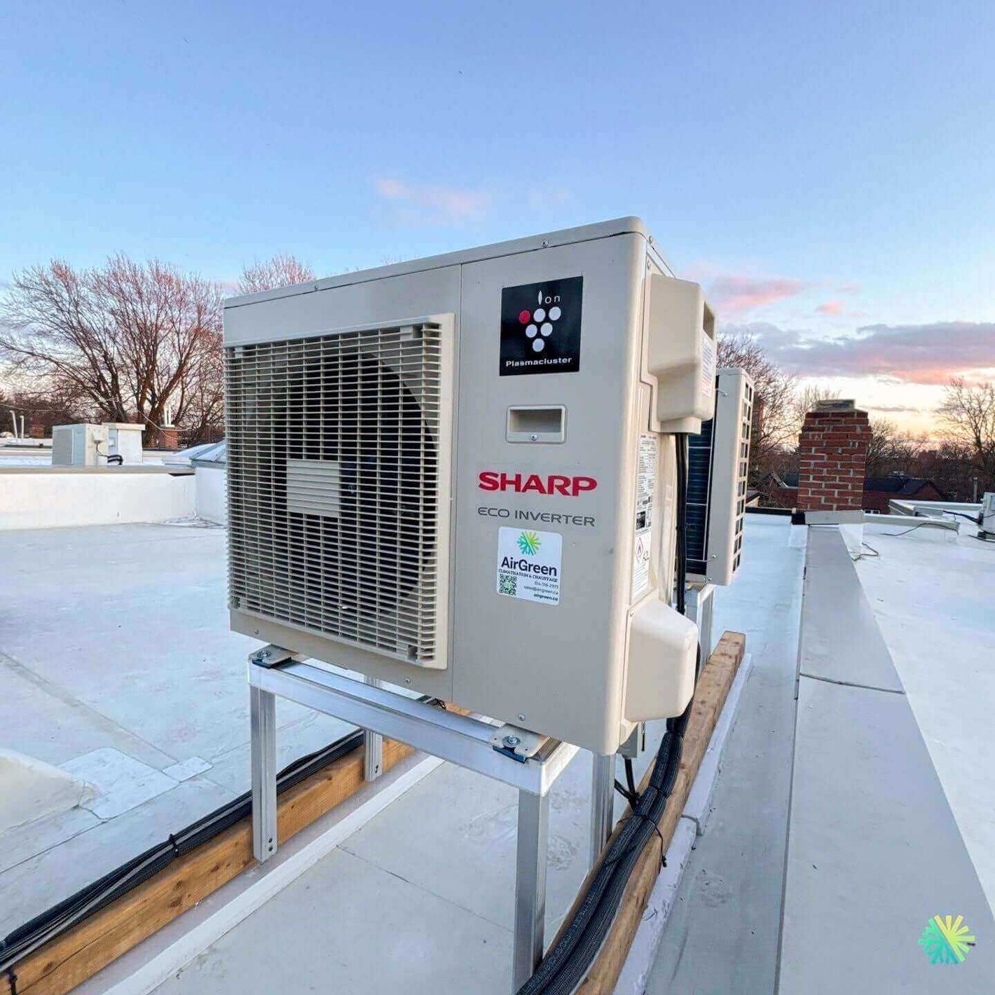 Eco-friendly Sharp inverter HVAC unit installed on a rooftop, promoting energy efficiency and sustainability.