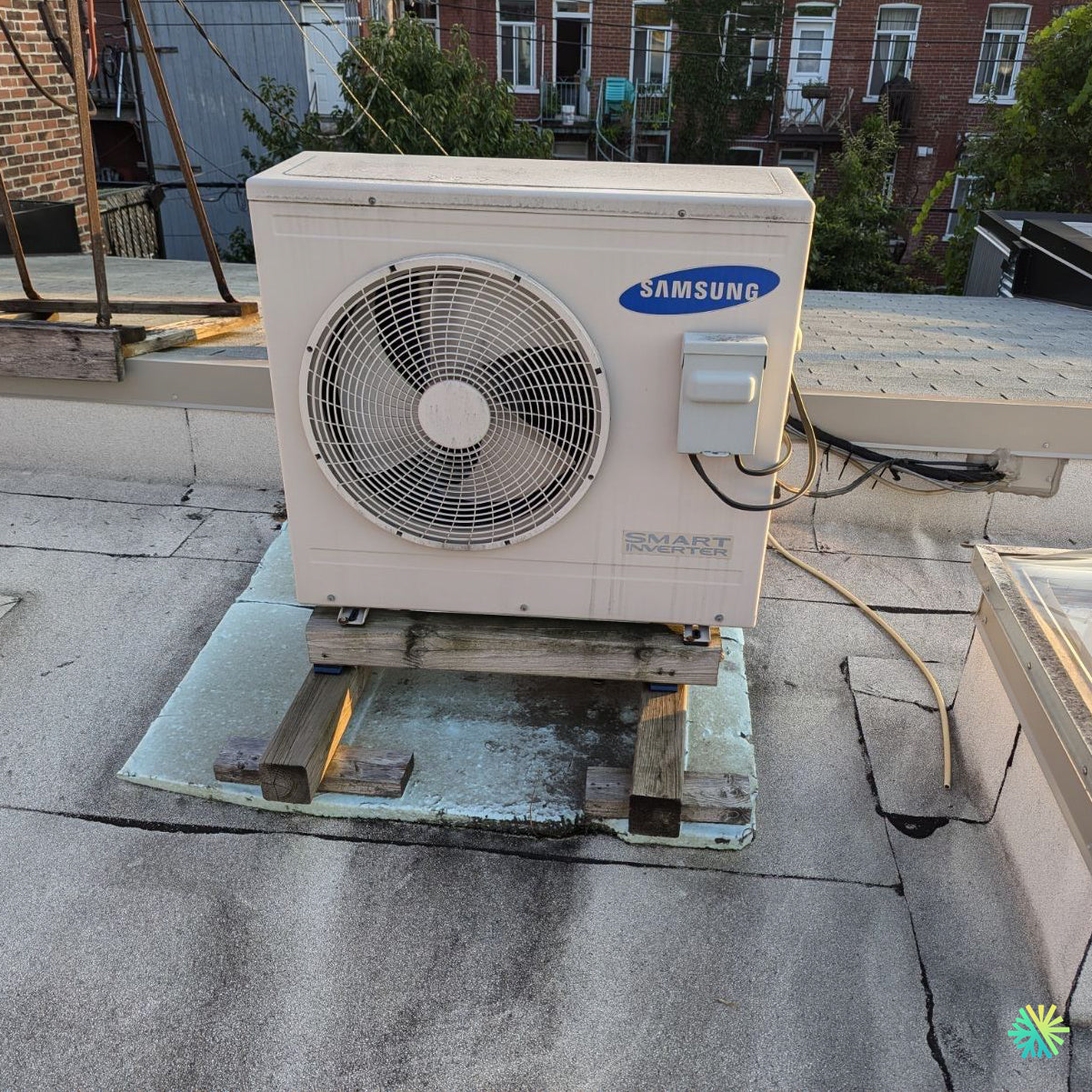 Rooftop Samsung air conditioning unit on a flat installation platform.