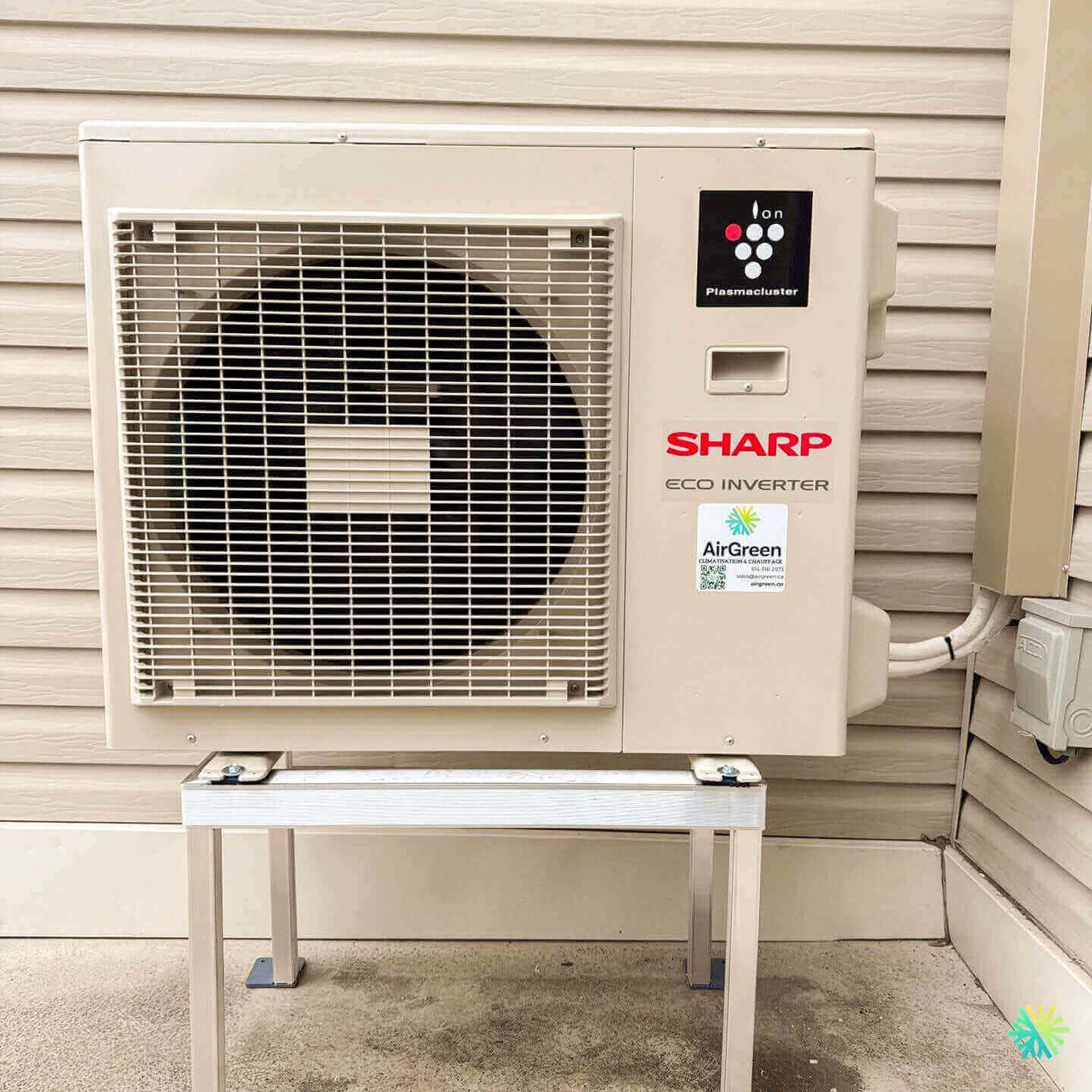 Sharp Eco Inverter air conditioner installed on a wall mount, featuring energy-efficient technology for home cooling.
