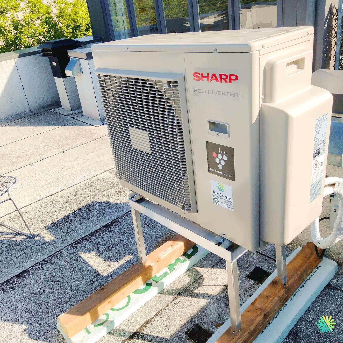 Outdoor eco-inverter AC unit on rooftop, highlighting energy efficiency and modern design.