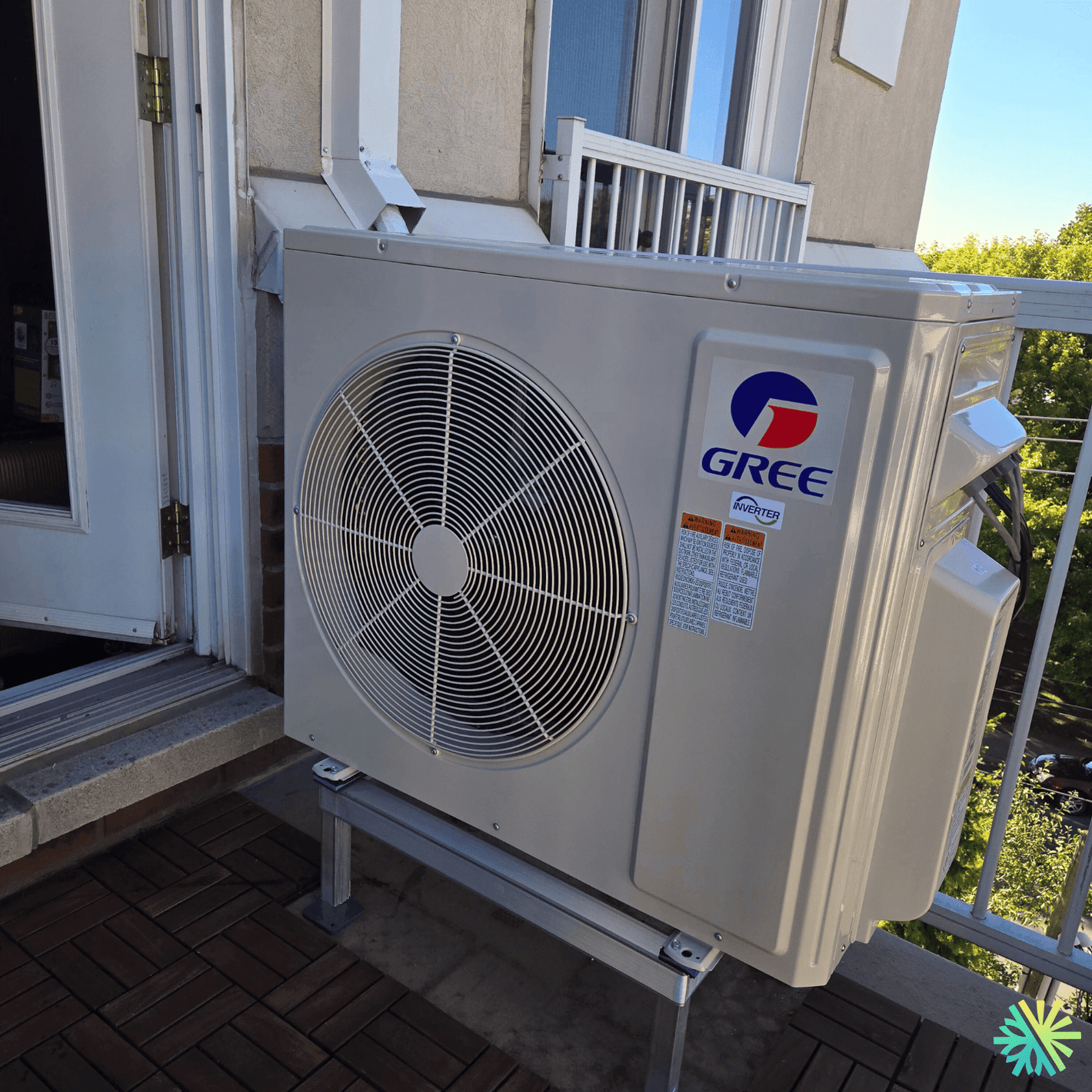 Outdoor Gree air conditioning unit installed on a balcony.