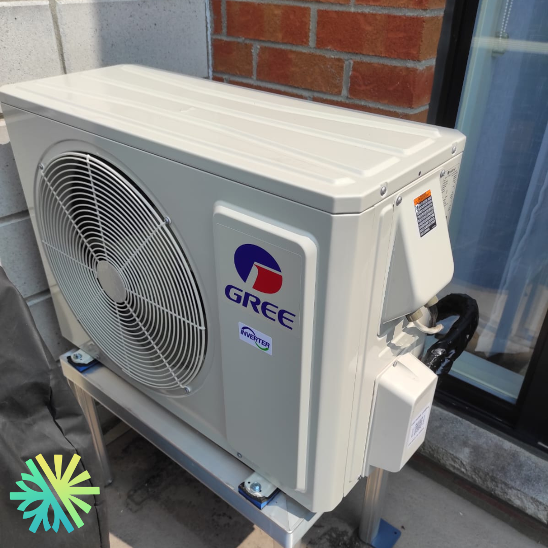 Gree air conditioning unit installed on a building exterior, showcasing energy-efficient cooling technology.