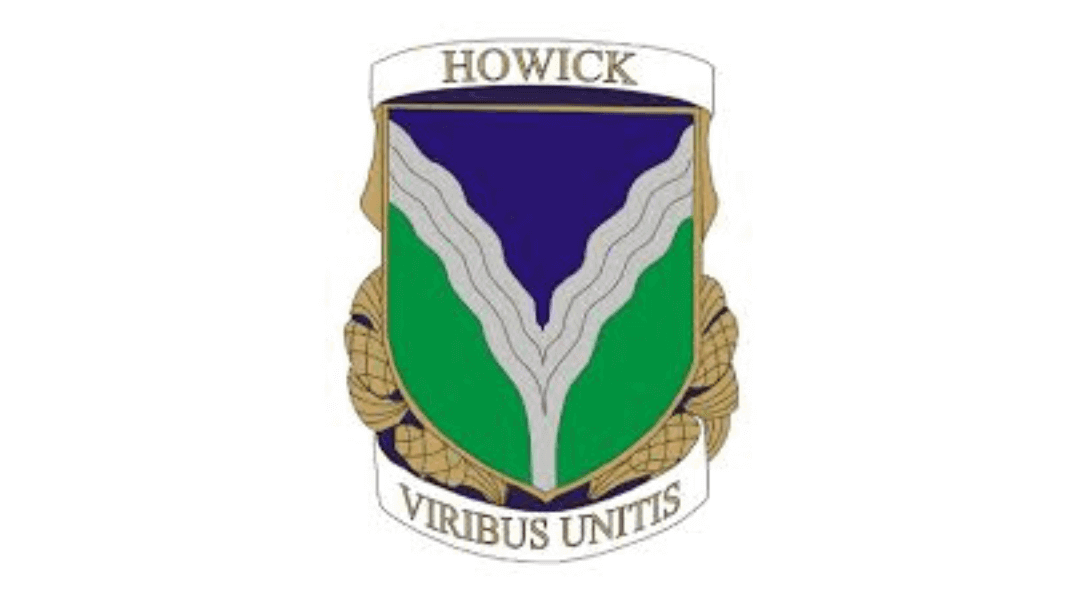 Howick school emblem with a blue and green shield, featuring "Viribus Unitis" motto.