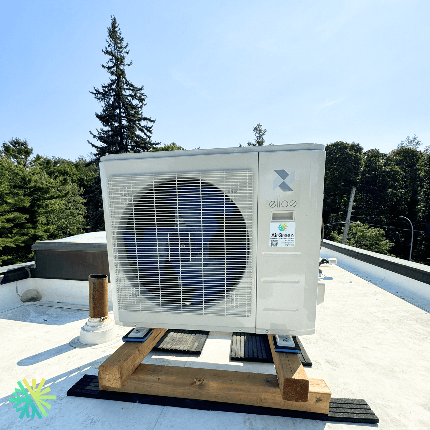 Rooftop air conditioning unit with trees in the background, showcasing eco-friendly technology and modern design.