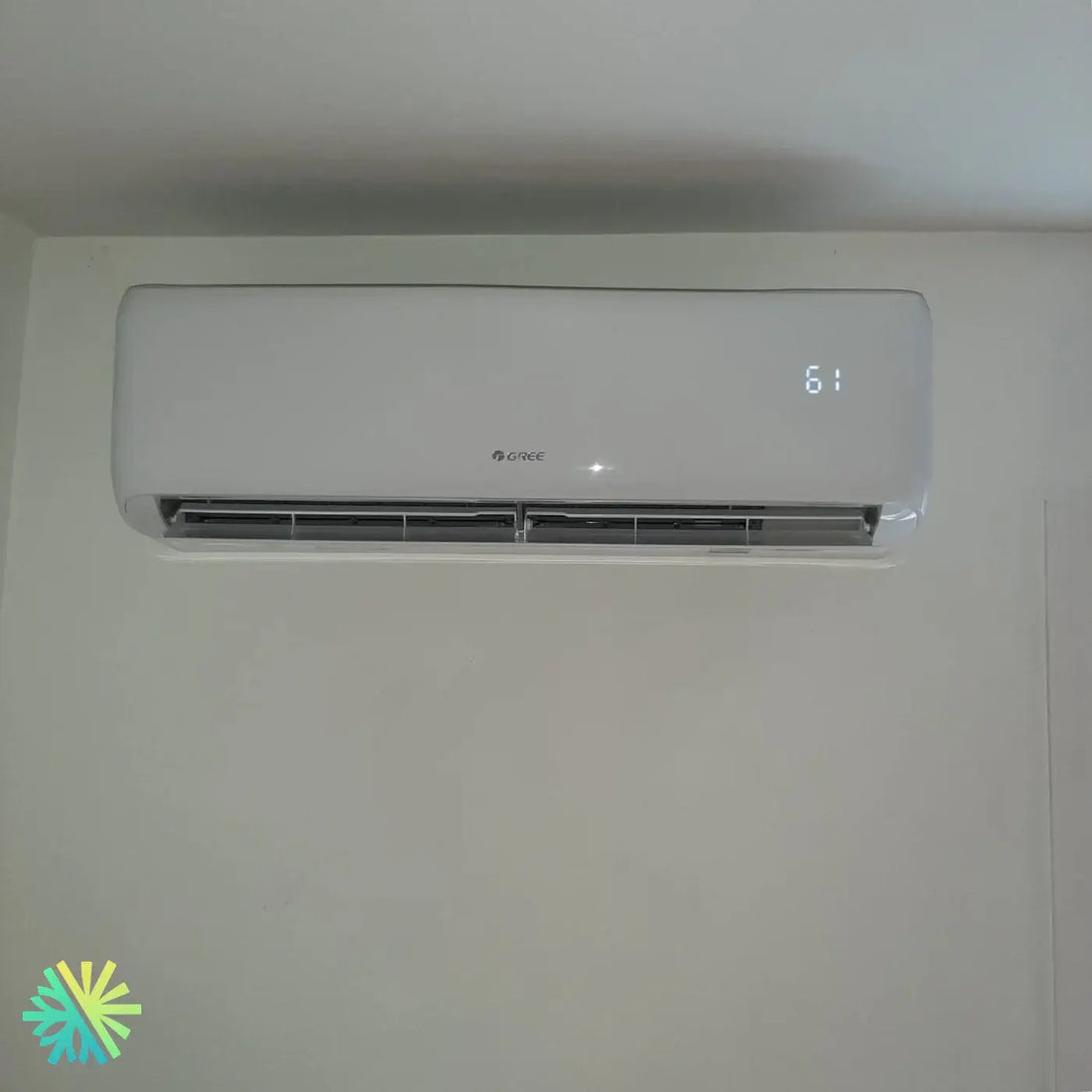 Wall-mounted air conditioner with LED display showing temperature