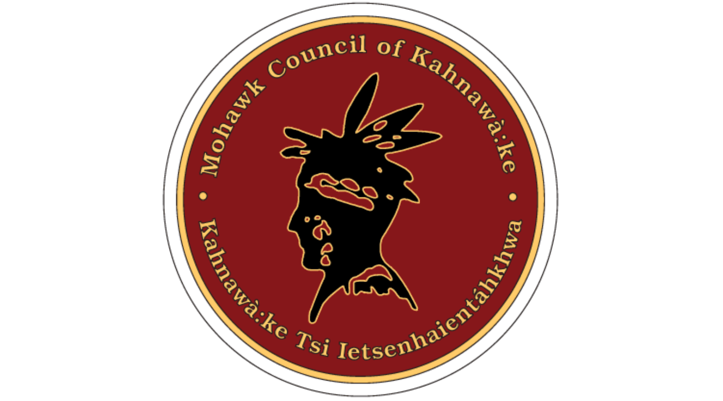 Logo of the Mohawk Council of Kahnawake with a red and black design.