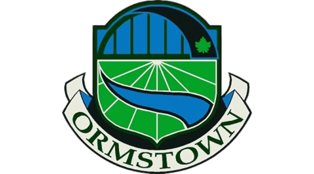Ormstown logo featuring a bridge, fields, river, and green maple leaf emblem.