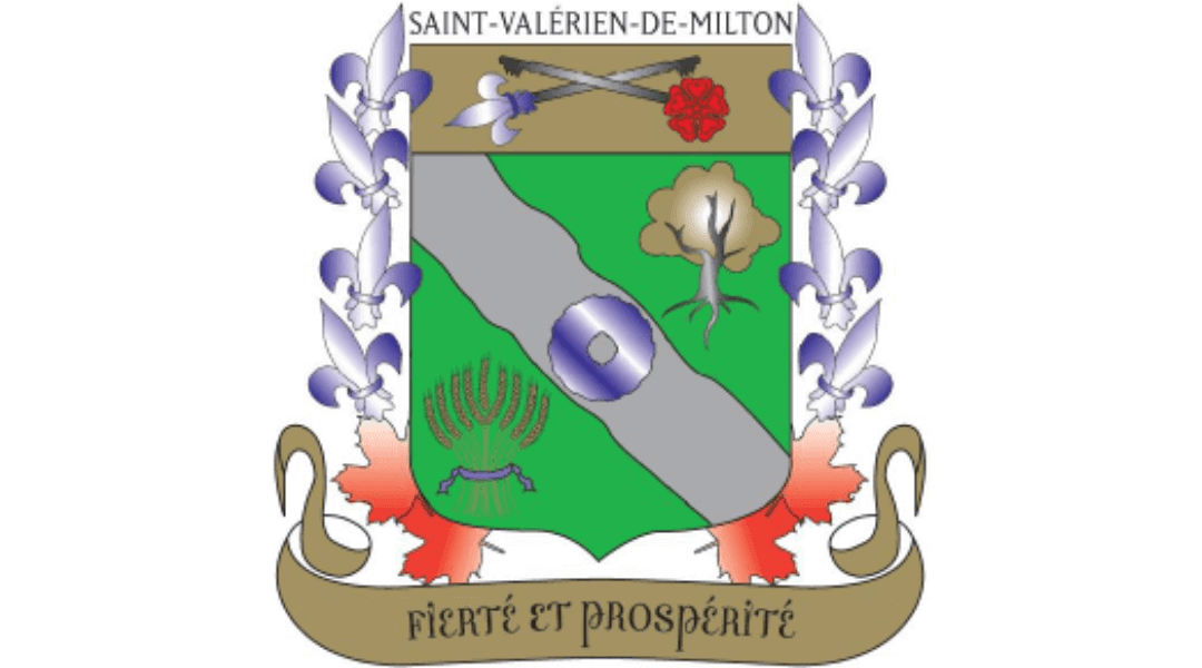 Coat of arms of Saint-Valérien-de-Milton featuring a green and silver shield with floral and tree symbols, motto 'Fierté et Prospérité.'