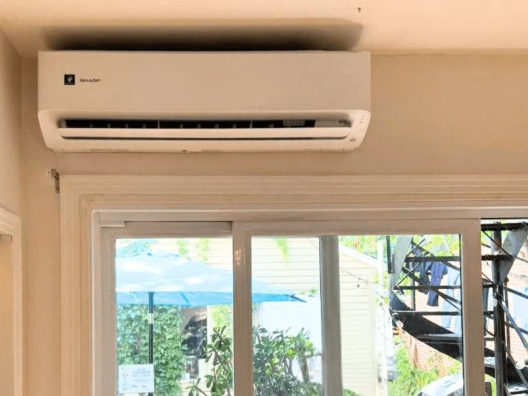 SHARP ZHU above the patio door, installed by AirGreen, Candiac, South Shore