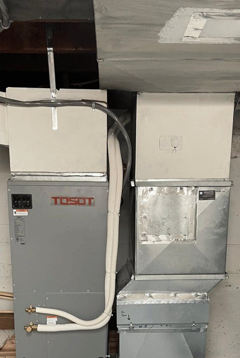 Thermopompe centrale Tosot APEX installée par AirGreen au sous-sol